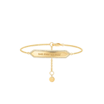 Gold bracelet with a rectangular tag and a round pendant on a white background