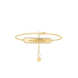 Gold bracelet with a rectangular tag and a round pendant on a white background