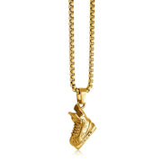 Stainless steel hockey skate necklace hanging on a gold coloured chain.