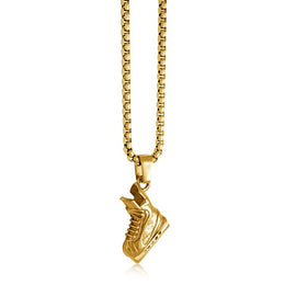 Stainless steel hockey skate necklace hanging on a gold coloured chain.