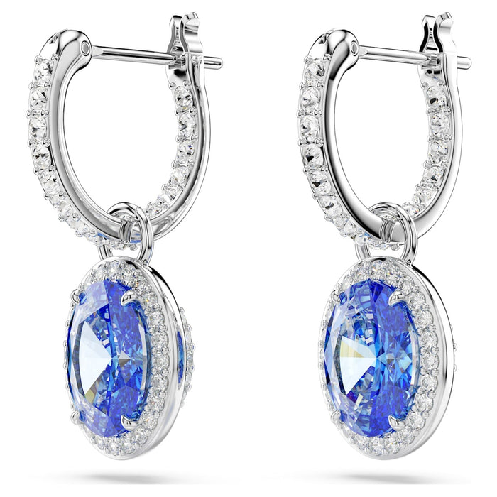 A pair of silver-tone rhodium-plated hoop earrings with oval-cut blue crystal stones encircled by halos of small round cubic zirconia, reflecting a timeless and opulent design.