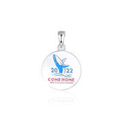 Come home year 2022 round circle pendant pictured without a chain. The design on the pendant features a blue coloured whale breaching the water with the year 