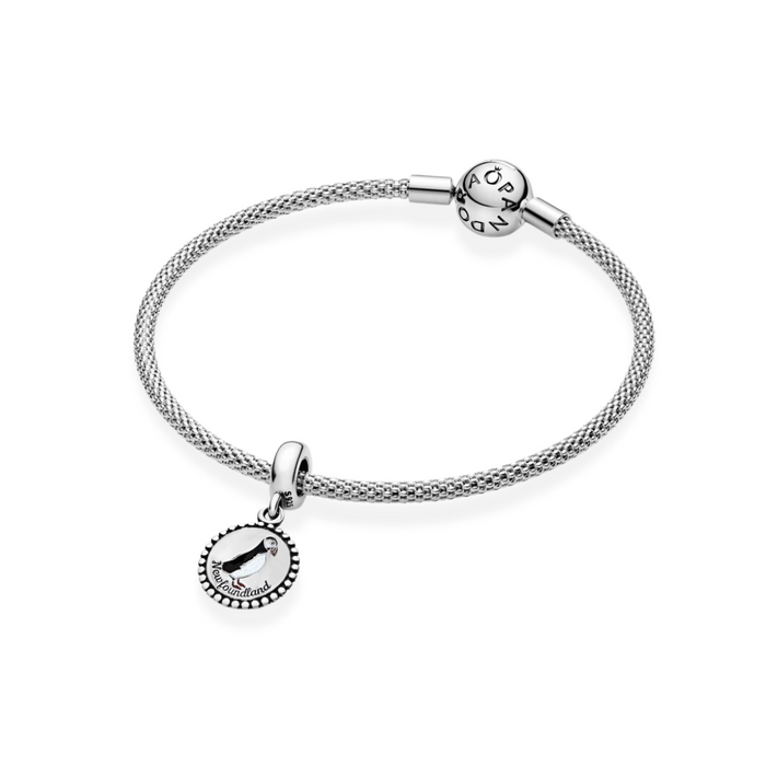 Pandora Puffin Dangle Charm on a sterling silver Pandora bracelet.